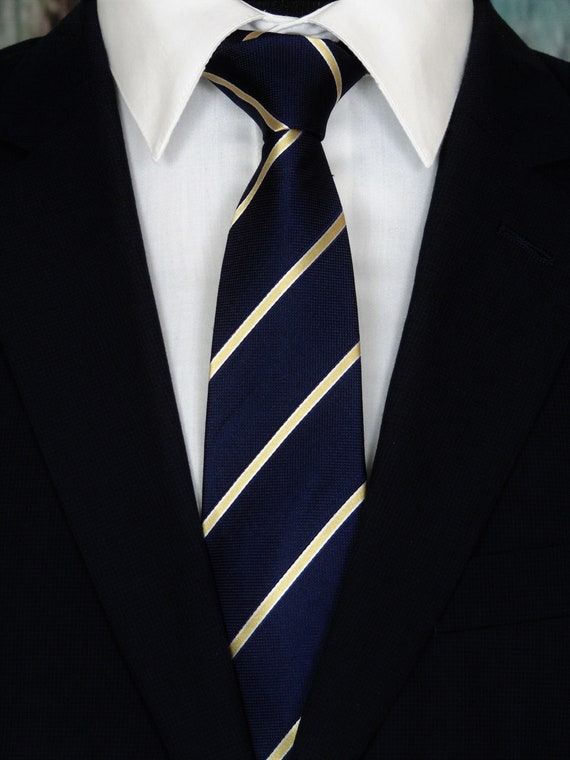 navy shirt gold tie