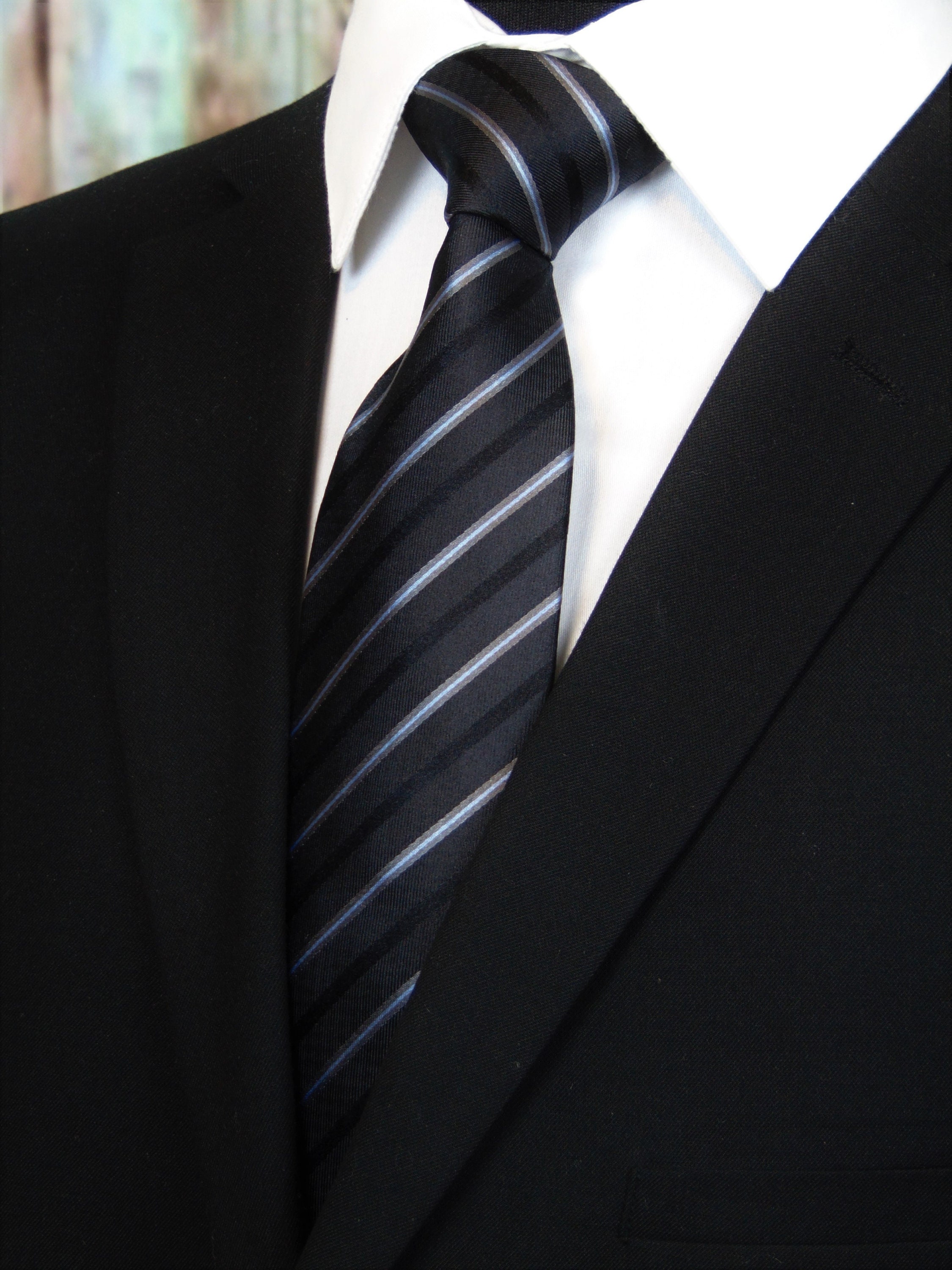 black tie with white stripe