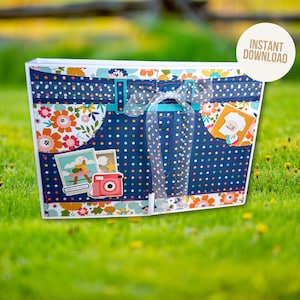 May include: A decorative scrapbook album with a denim-inspired design, featuring blue polka dots, floral patterns, and a sheer ribbon. The album includes small photo stickers of a camera and other images. The text "INSTANT DOWNLOAD" is visible on a white circle.