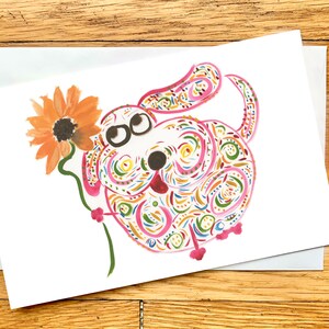 Cartão de felicitações de cachorro rosa caprichoso com flor de laranja - cartão de alta qualidade - cartão em branco para todas as ocasiões - personalizável