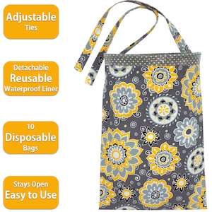 May include: A gray and yellow reusable diaper bag with adjustable ties. It has a detachable waterproof liner and comes with 10 disposable bags. The bag has a floral pattern and says "Stays Open Easy to Use".