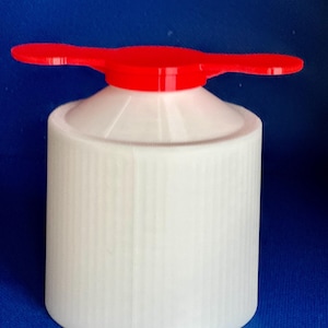 May include: White plastic bottle cap with a red, two-pronged, twist-top lid.