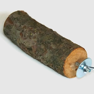 May include: A natural wood perch for birds, with a metal screw and washer for attaching to a cage.