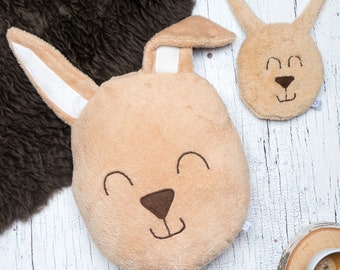 Cuddly set bunnies consisting of pillows and grain pillows