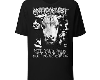May include: A black short-sleeve t-shirt featuring a white graphic of a cow with the number 269 on its ear tag. Above the cow is the text ANTICARNIST, and below the cow is the text NOT YOUR BODY NOT YOUR LIFE NOT YOUR CHOICE in a distressed font.