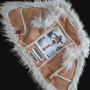 Handmade suede vest with bold statement patch, bohemian rock and western inspired fashion.