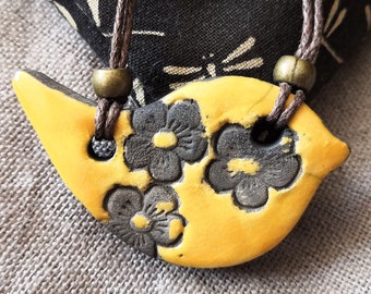 Bird necklace yellow flowers in raku ceramic BIRDY, different variants, jewelry inspired by nature, natural jewelry, mustard