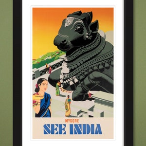 May include: A vintage travel poster advertising "See India" with a large black stone sculpture of a bull in the foreground. The bull is adorned with intricate carvings and jewelry. A woman in a blue sari stands in the background, looking at the bull.