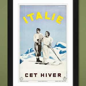 May include: A vintage travel poster advertising skiing in Italy. The poster features a couple in winter clothing skiing down a snowy mountain with the text "ITALIE CET HIVER" in yellow and red.