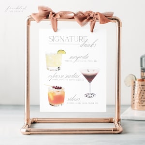 May include: A printable sign with a copper pipe stand, featuring a list of signature drinks with watercolor illustrations of each drink. The drinks are a margarita, espresso martini, and sidecar.
