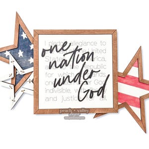 May include: A wooden sign with a red, white and blue star design. The sign features the text "I pledge allegiance to the United States of America, and to the Republic for which it stands, one nation under God, indivisible, with liberty and justice for all." The sign also includes the text "peach + valley bsigns".
