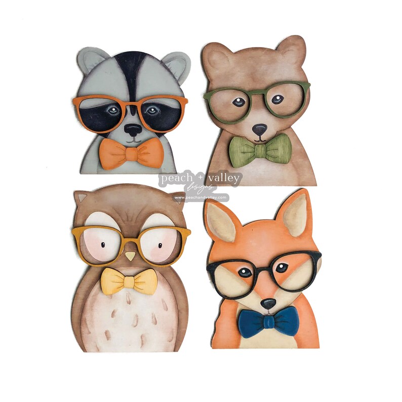 May include: Four wooden animal figures with glasses and bow ties. A raccoon, a bear, an owl, and a fox. The animals are all wearing glasses and bow ties. The raccoon has orange glasses and a bow tie, the bear has green glasses and a bow tie, the owl has yellow glasses and a bow tie, and the fox has blue glasses and a bow tie.