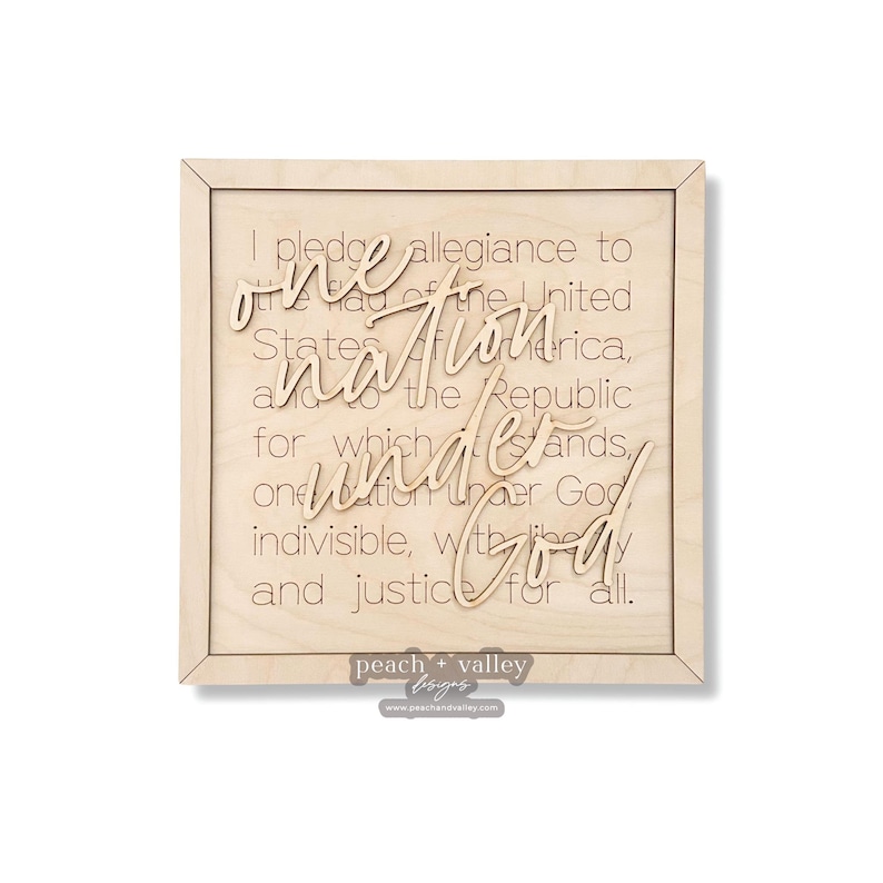 May include: A wooden sign with the text "I pledge allegiance to the flag of the United States of America, and to the Republic for which it stands, one nation under God, indivisible, with liberty and justice for all." The sign is framed in wood and has a light wood finish.