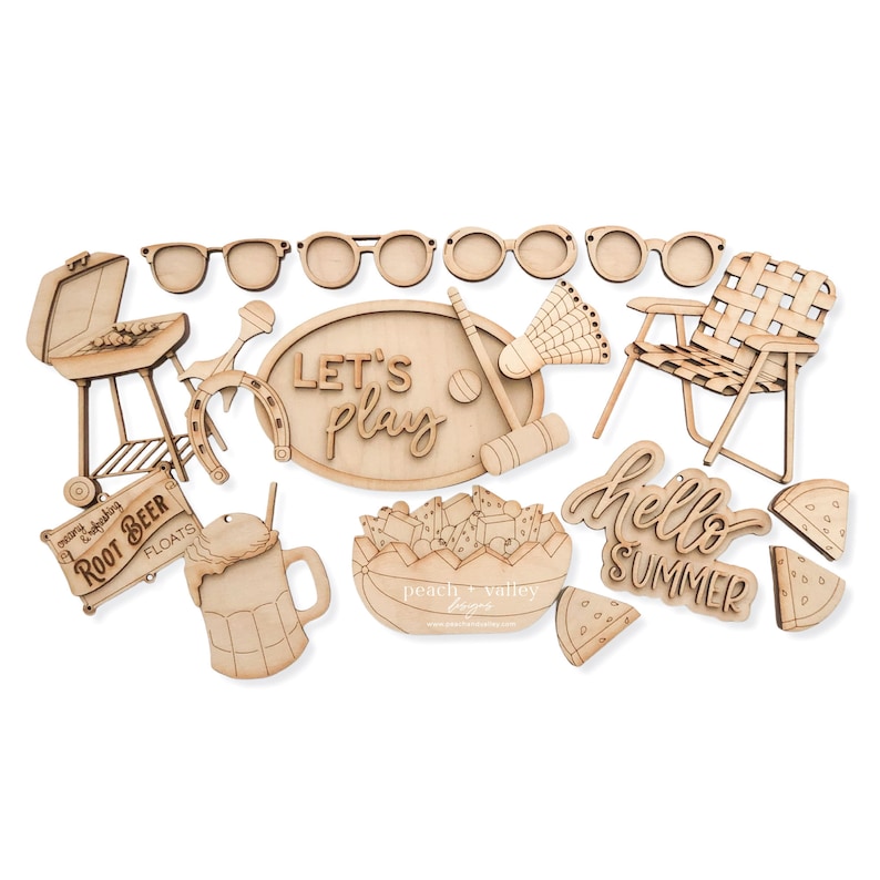 May include: A set of 14 laser cut wooden shapes for crafting projects. The shapes include a grill, horseshoe, sunglasses, a chair, a watermelon, a root beer float, a sign that says "Root Beer Floats", a sign that says "Let's Play", a bowl of fruit, a badminton racket, a croquet mallet, and a sign that says "Hello Summer".
