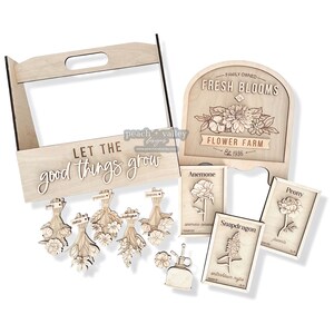May include: Wooden craft kit for making a flower shop sign. The kit includes a sign that says "Fresh Blooms Flower Farm Est. 1986", a wooden crate with the text "Let the good things grow", and several flower bouquets with labels.