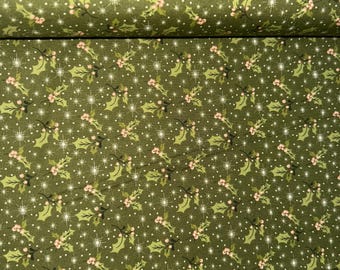 May include: Green fabric featuring a repeating pattern of holly leaves, pink berries, and white starbursts. The design has a festive, holiday theme, ideal for seasonal crafts and decorations.