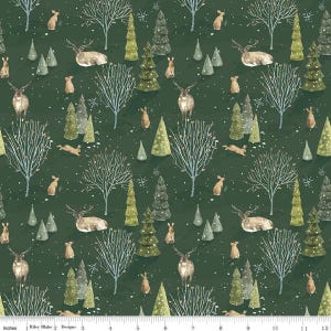 May include: Dark green fabric with a repeating pattern of deer, rabbits, trees, and bare winter trees. The design includes various shades of green and brown, with white accents. The text "Riley Blake Designs" is at the bottom.