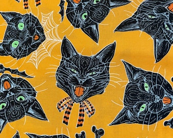 Scaredy Cat- by Rachel Hauer for free spirits on an orange background/Cotton/ Sold by the half yard