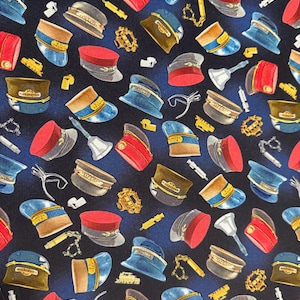 Michael Miller - Full Steam Ahead bells, and whistles fabric on a blue baackground/ Cotton/ Sold by the half yard
