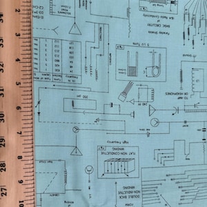 Circuits design fabric on a blue baackground by Judy Gauthier for Ink & Arrow fabrics/ Cotton/ Solf by the half yard