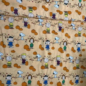 Peanuts Gang Pumpkin Patch fabric by Peanuts Worldwide LLC for Spring Creative/Cotton/ Sold by the half yard