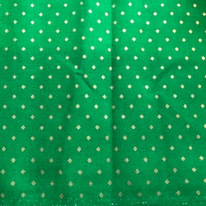 May include: Green fabric with a white diamond pattern. The fabric has a label that reads "Michael Miller Fabrics" and "CM-8072".
