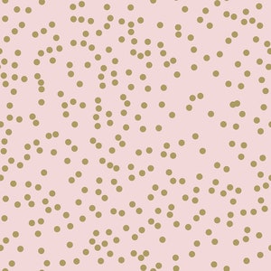 May include: A pink background with a scattered pattern of gold circles.