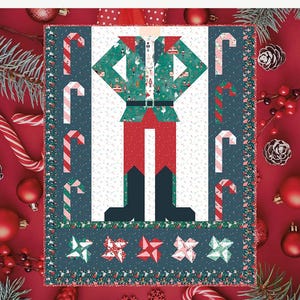 以下が含まれることがあります： クリスマスのテーマのキルトパターン。緑のジャケット、赤いズボン、黒いブーツを履いた、様式化されたエルフの姿が描かれています。キャンディケーンと星の形が中央の画像を縁取っています。「BE A NUTCRACKER」の文字が上部にあります。