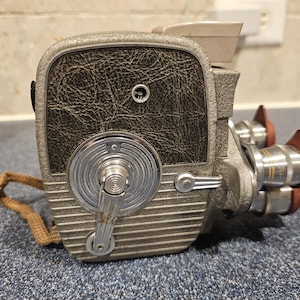 May include: A set of three ceramic mugs with a speckled, matte finish. The mugs are in shades of cream, light gray, and dark gray. Each mug has a simple, minimalist design, perfect for coffee or tea.