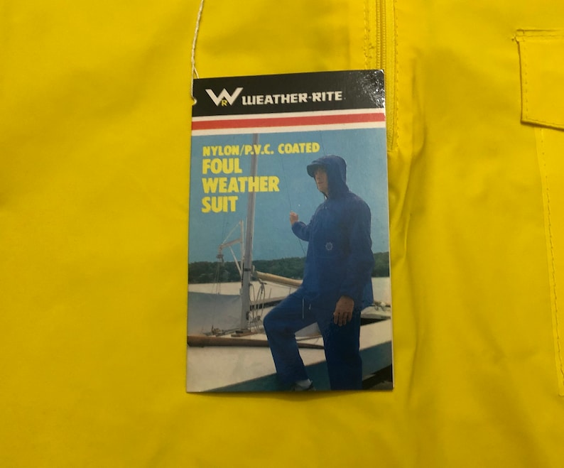 May include: A yellow nylon foul weather suit with a zipper closure and a patch pocket. The tag reads "Weather-Rite" and "Nylon/P.V.C. Coated Foul Weather Suit".