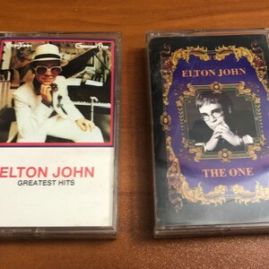 Two (2) Elton John cassette tapes 1974 Greatest Hits & 1992 The One vintage 70's 90's E