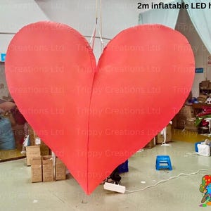 LED inflatable love heart illuminating the dance floor at a wedding party.