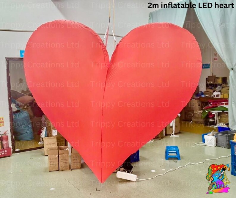 LED inflatable love heart illuminating the dance floor at a wedding party.