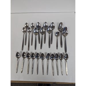 May include: A set of three ceramic mugs with a speckled, matte finish. The mugs are in shades of cream, light gray, and dark gray. Each mug has a simple, modern design and a rounded handle. Perfect for coffee or tea.