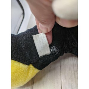 May include: Black and yellow plush toy with a white tag that reads "Made in China, All New Material, Reg. No. PA 13355 (CN)  ",  "british":