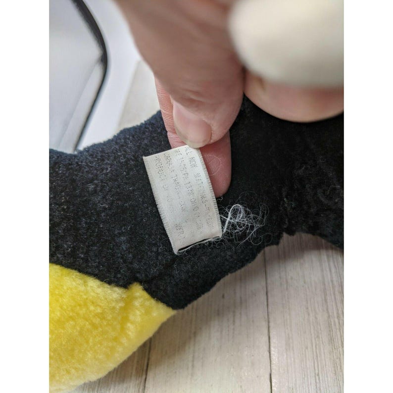 May include: Black and yellow plush toy with a white tag that reads "Made in China, All New Material, Reg. No. PA 13355 (CN)  ",  "british":