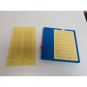 May include: A blue plastic game board with a yellow paper insert. The insert has a grid with numbers 1 through 10. There are two yellow paper sheets with red numbers and the text "2 Players" and "1 Player".