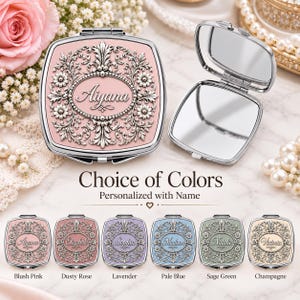 May include: A square compact mirror with a silver-toned ornate floral frame and a central oval plaque featuring the name Aiyana. The set includes an open mirror and six color variations labeled Blush Pink, Dusty Rose, Lavender, Pale Blue, Sage Green, and Champagne.