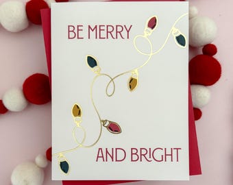 Juego de tarjetas navideñas con luces alegres y brillantes