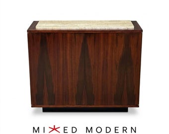 May include: A rectangular wooden cabinet featuring a dark brown wood grain finish with two vertical doors and a light beige textured stone top. The text MIXED MODERN is printed below the cabinet with a red star symbol in the center.