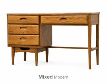 May include: A wooden desk with a natural brown finish featuring three stacked drawers on the left side, one wide drawer on the right, and tapered legs. The desk includes recessed oval-shaped drawer pulls and a lower open storage shelf.
