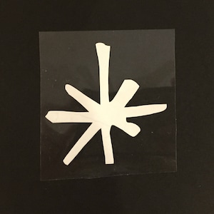 May include: A white starburst sticker on a clear background.