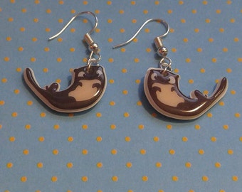 Playful otter earrings