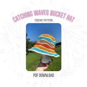 May include: A crochet bucket hat with a colourful striped pattern in shades of orange, yellow, blue, and brown. The hat is on a white mannequin head and the text "CATCHING WAVES BUCKET HAT CROCHET PATTERN PDF DOWNLOAD" is below the image.