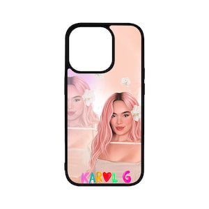 May include: A black phone case with a pink and white design featuring a woman with pink hair and white flowers. The text "KAROL G" is printed on the bottom of the case in colourful letters.