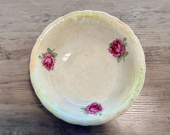 Vintage semi-porcelain bowl features a unnamed dark pink rose pattern produced by the Crown Potteries Company.