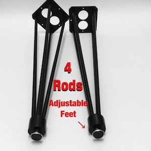 May include: Four black metal table legs with adjustable feet. The legs are in a tripod shape and have a square plate at the top. The text "4 Rods Adjustable Feet" is written in red on a white background.