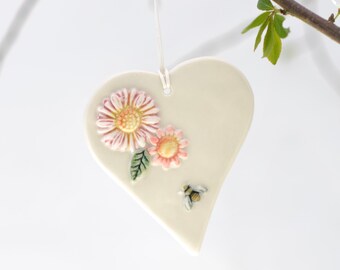 hanging Porcelain heart with bee and pink daisies.Hand made,painted and glazed Ceramic Decoration mothers day gift.Indoor/outdoor hanging