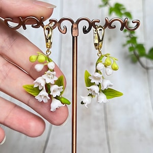 Delicate handmade earrings with lily of the valley from polymer clay. Floral jewelry for the bride with white flowers. A unique gift for her