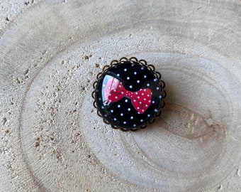 Cabochon brooch, serrated, black with red bow polka dots, rockabilly